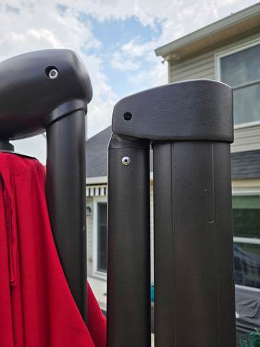 A black object with a red cloth from it

AI-generated content may be incorrect.