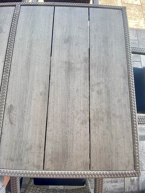 A wood table with a wicker back

AI-generated content may be incorrect.