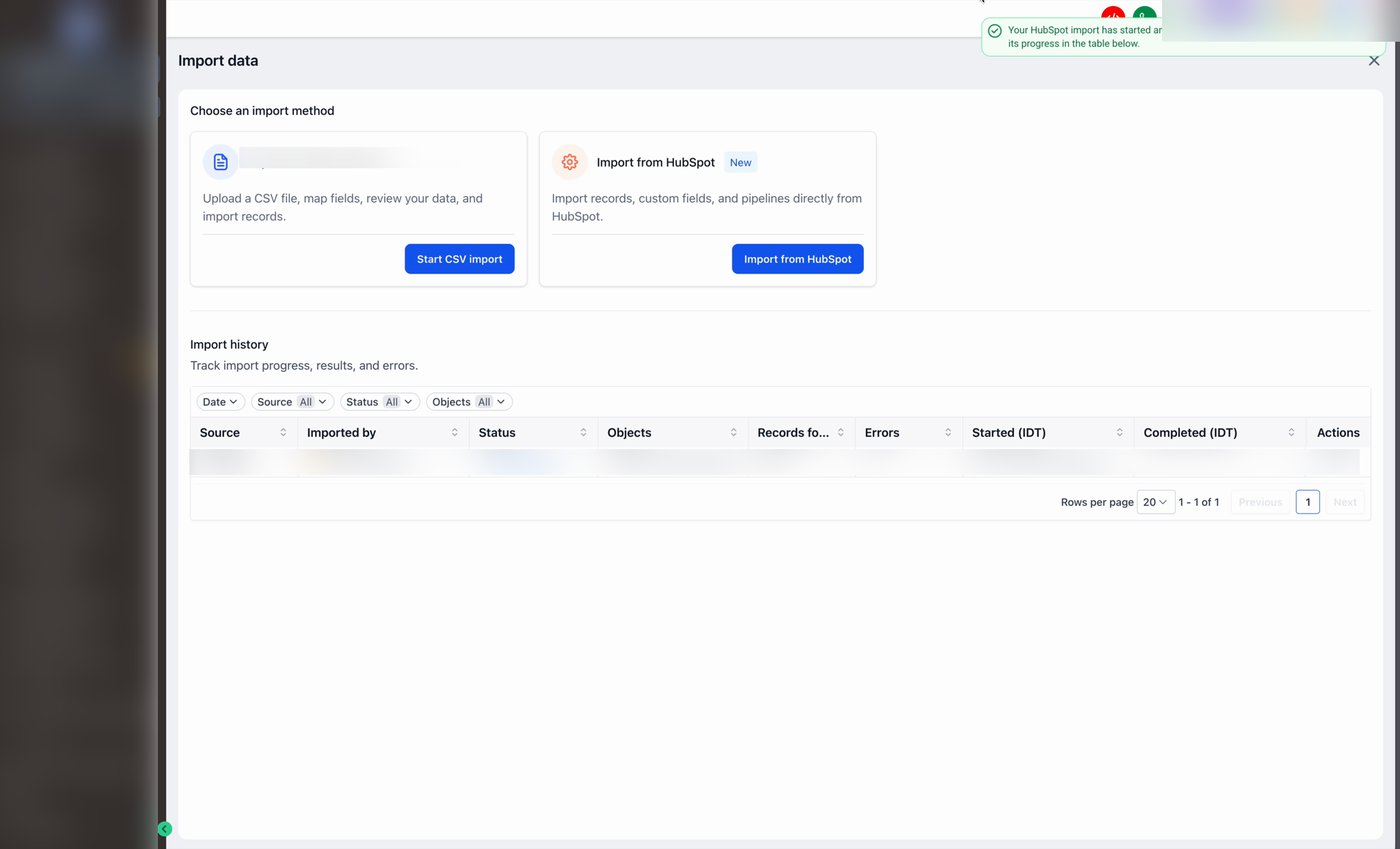 A success toast at the top reading Your HubSpot import has started, with the Import history table below showing the in-progress run.