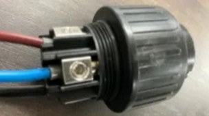 A black plastic object with a black plastic cap
AI-generated content may be incorrect.