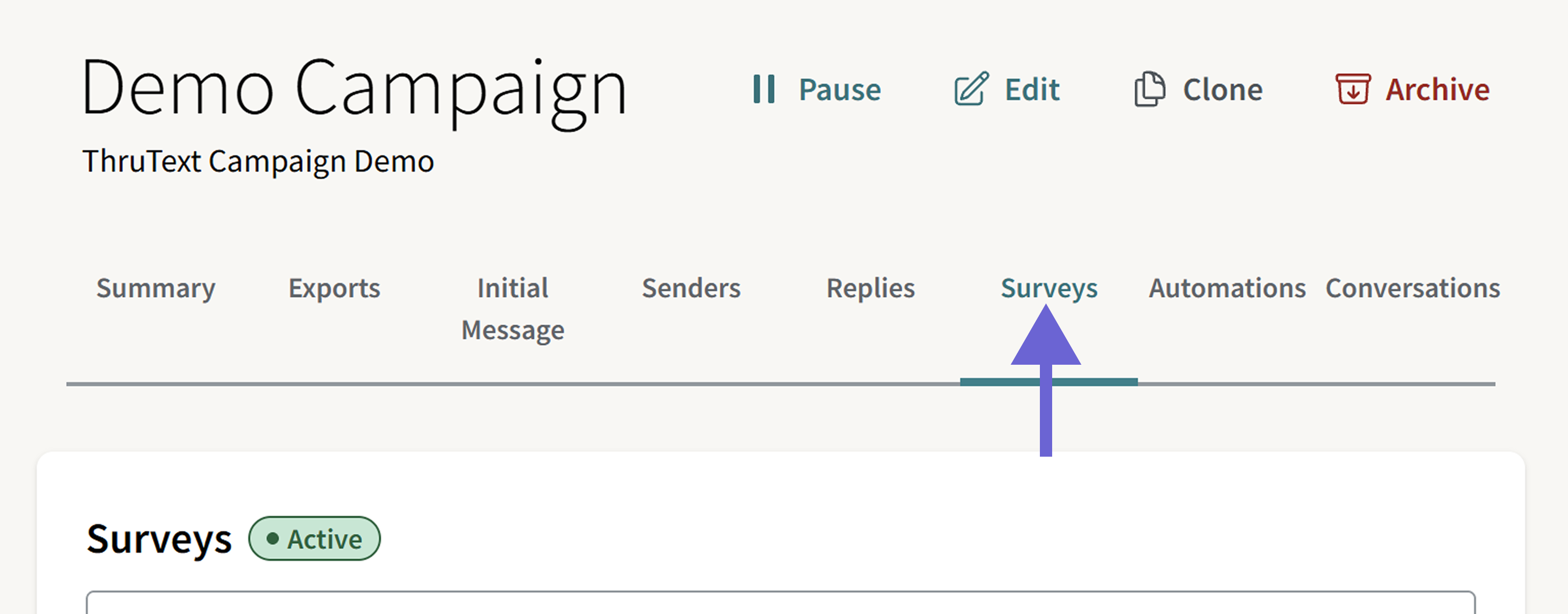 This image shows the campaign summary page for an active campaign and highlights where to navigate to the Surveys page.