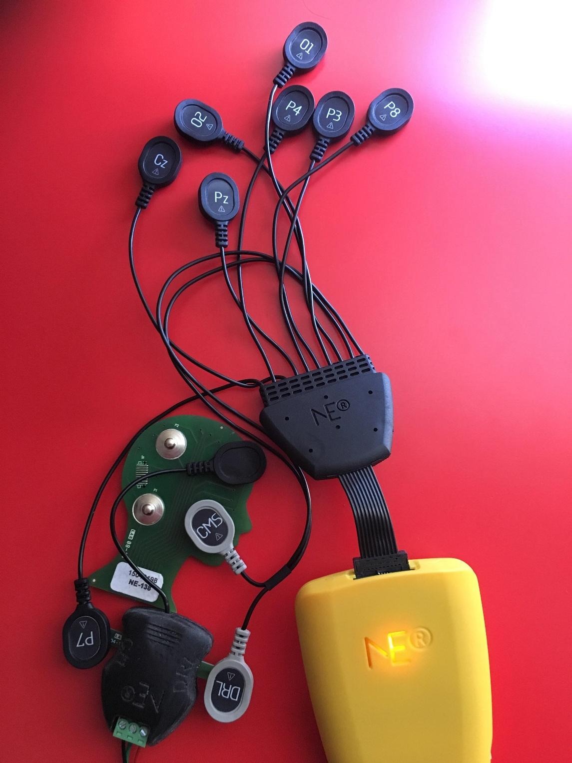 A device with wires attached to it 
AI-generated content may be incorrect.