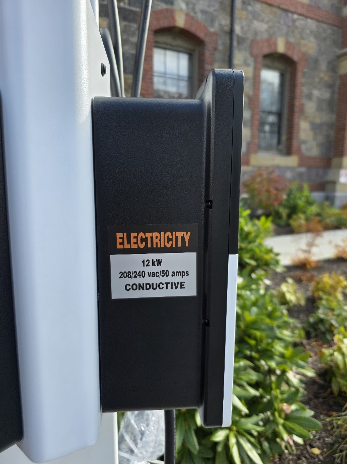 Close-up of Autel EV charger specifications label showing 12 kW, 208/240 vac/50 amps, and conductive charging type