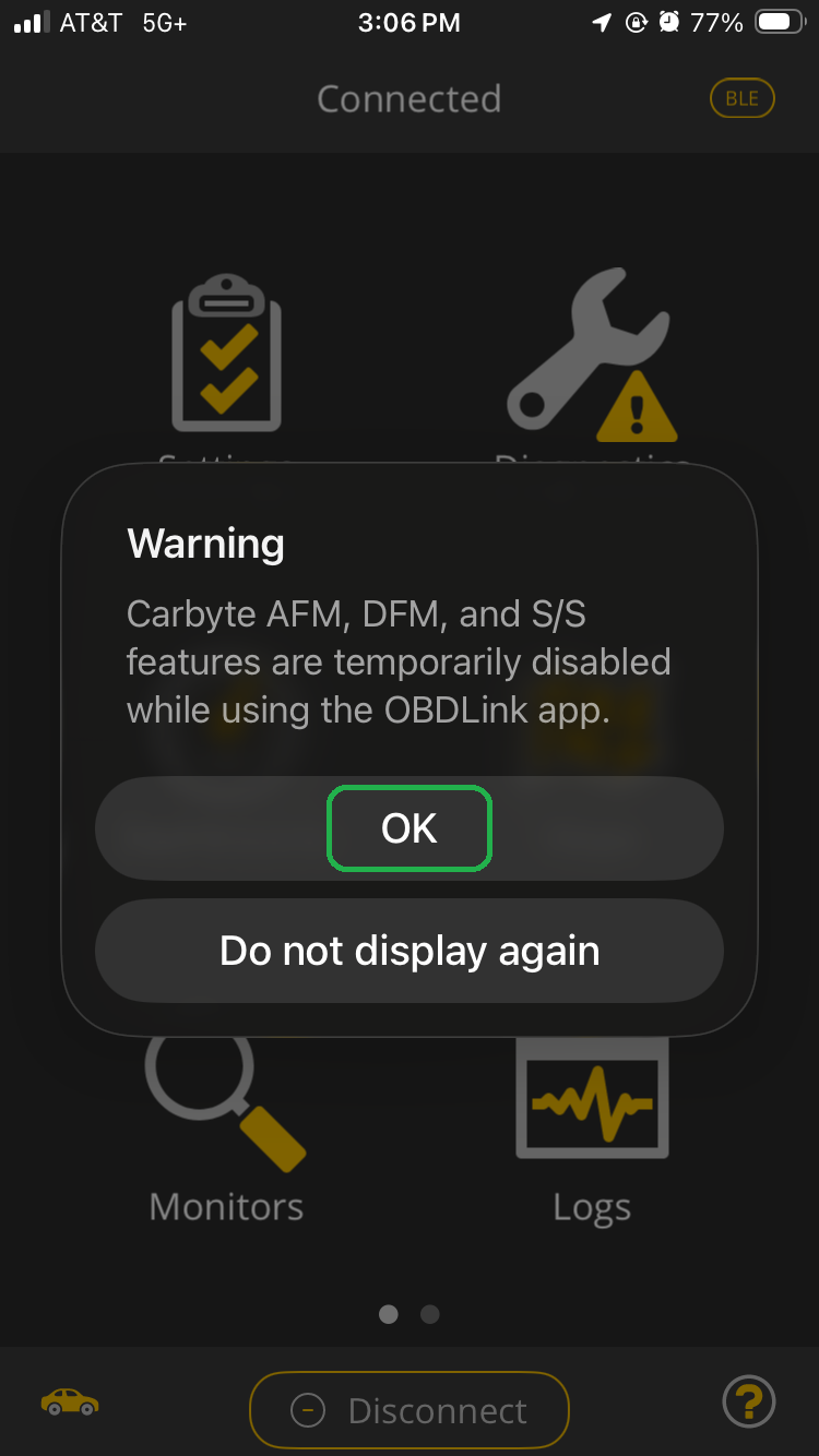 iOS screen showing a Warning message in the OBDLink app. The message explains that the Carbyte features can't be used while you are using the OBDLink app. The OK button is highlighted.