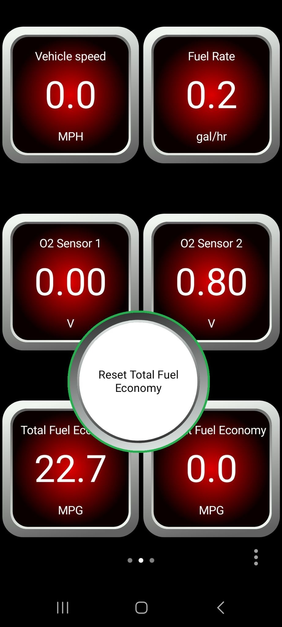 Android screen showing a dashboard view. The "Reset total fuel economy" push button is highlighted.