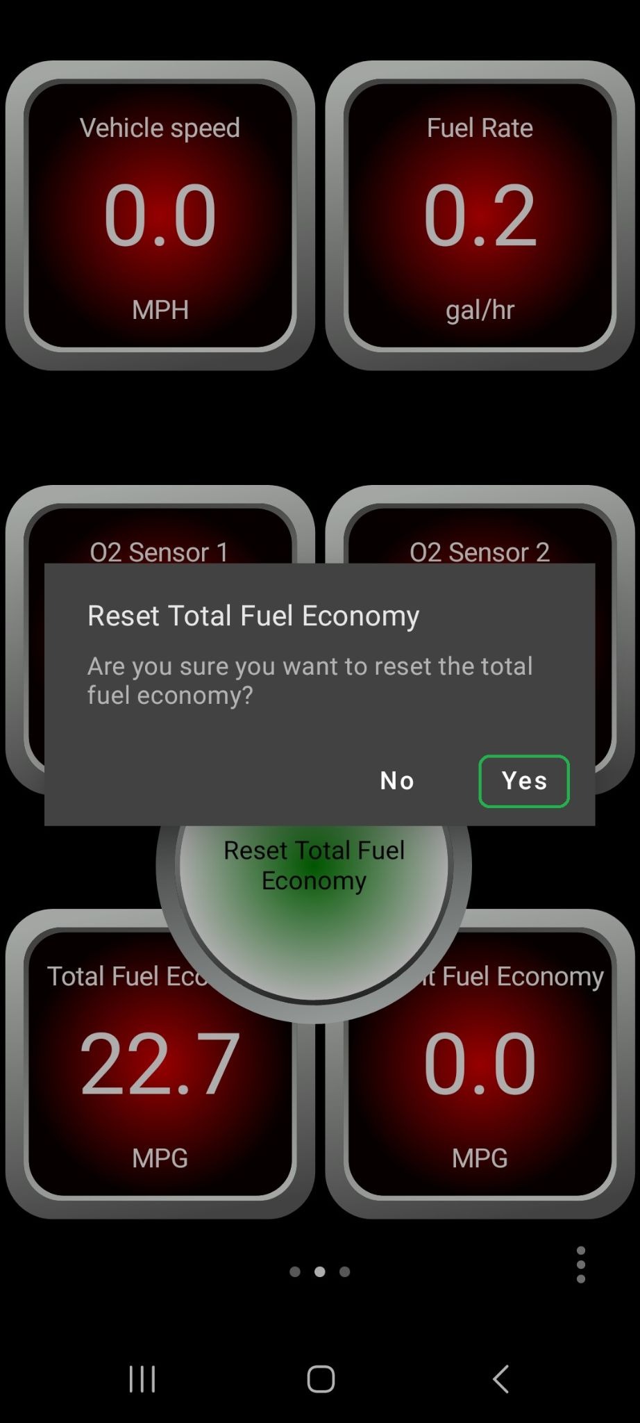 Android screen showing a confirmation window about resetting the total fuel economy value. The Yes button is highlighted.