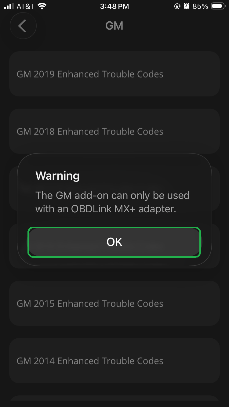 iOS confirmation screen showing a message about GM add-ons. The OK button is highlighted.