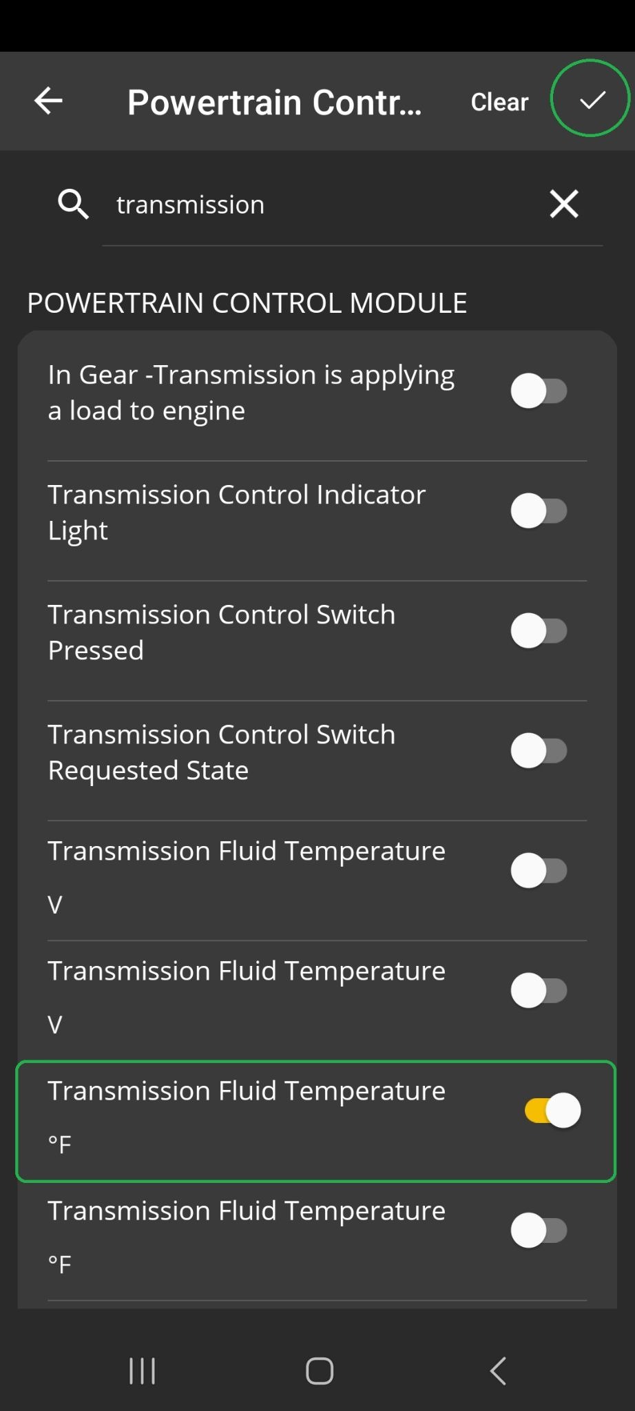 Android Logging screen showing the Powertrain Control Module list. The search field contains the word "Transmission". The PID named "Transmission Fluid Temperature degree F" is highlighted. The Checkmark in the upper right corner is also highlighted.
