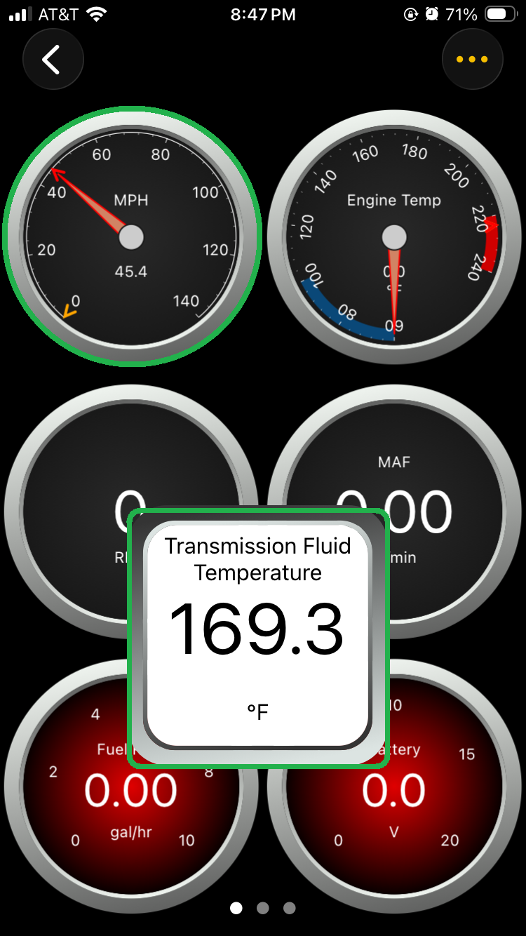 iOS Dashboard screen showing gauges. The gauge for Vehicle Speed and Transmission Fluid Temperature are both highlighted.