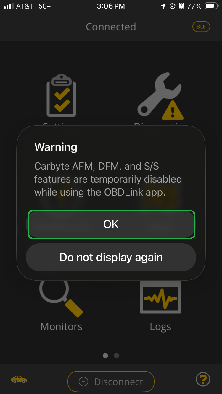 iOS screen showing a Warning message in the OBDLink app. The message explains that the Carbyte features can't be used while you are using the OBDLink app. The OK button is highlighted.