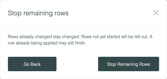 Stop remaining rows: rows already changed stay changed, rows not yet started will be left out, and a row already being applied may still finish
