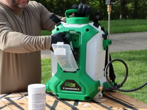 man removing the battery from a flowzone typhoon 3