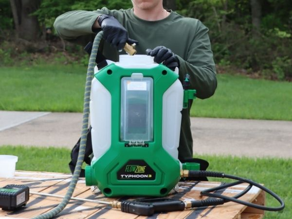man filling flowzone typhoon 3 using hose