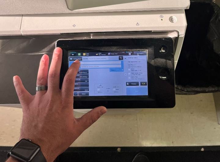 A hand touching a screen

Description automatically generated