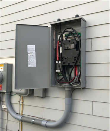 An open enclosure attached to the exterior of a building.