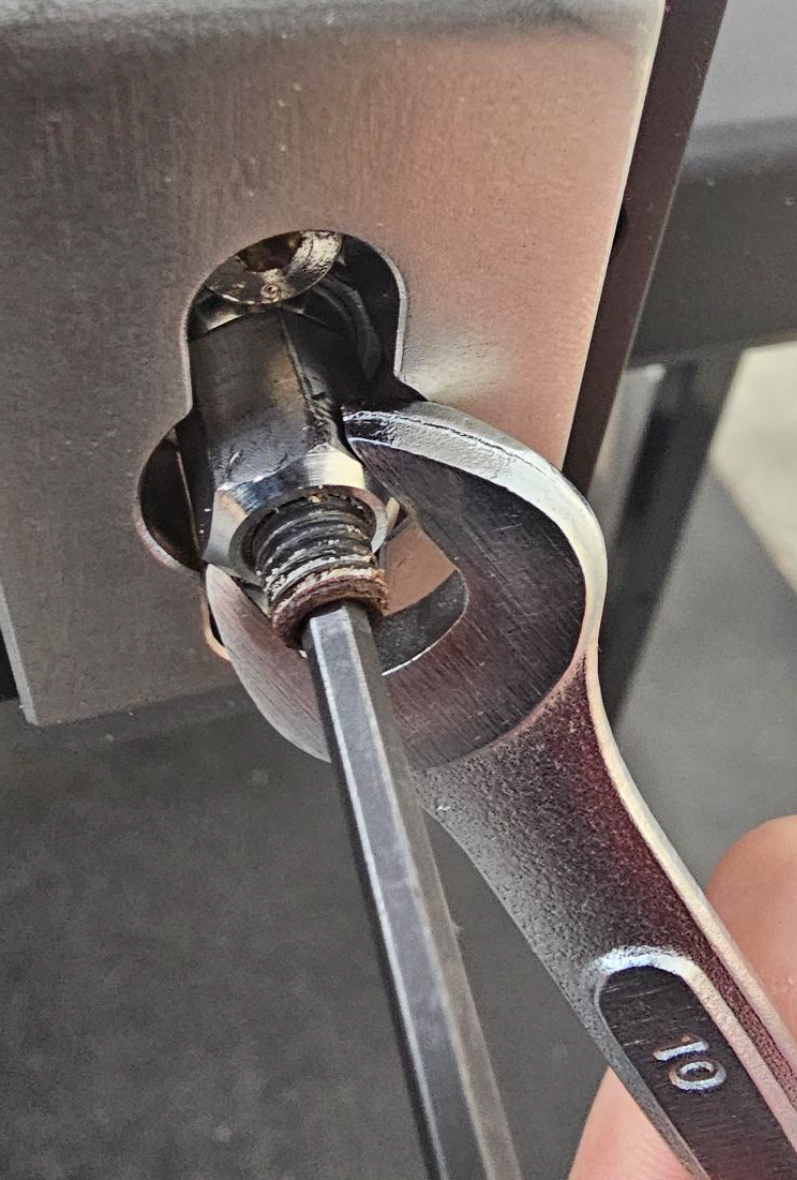 Threading pull rod lock nut onto lock rod