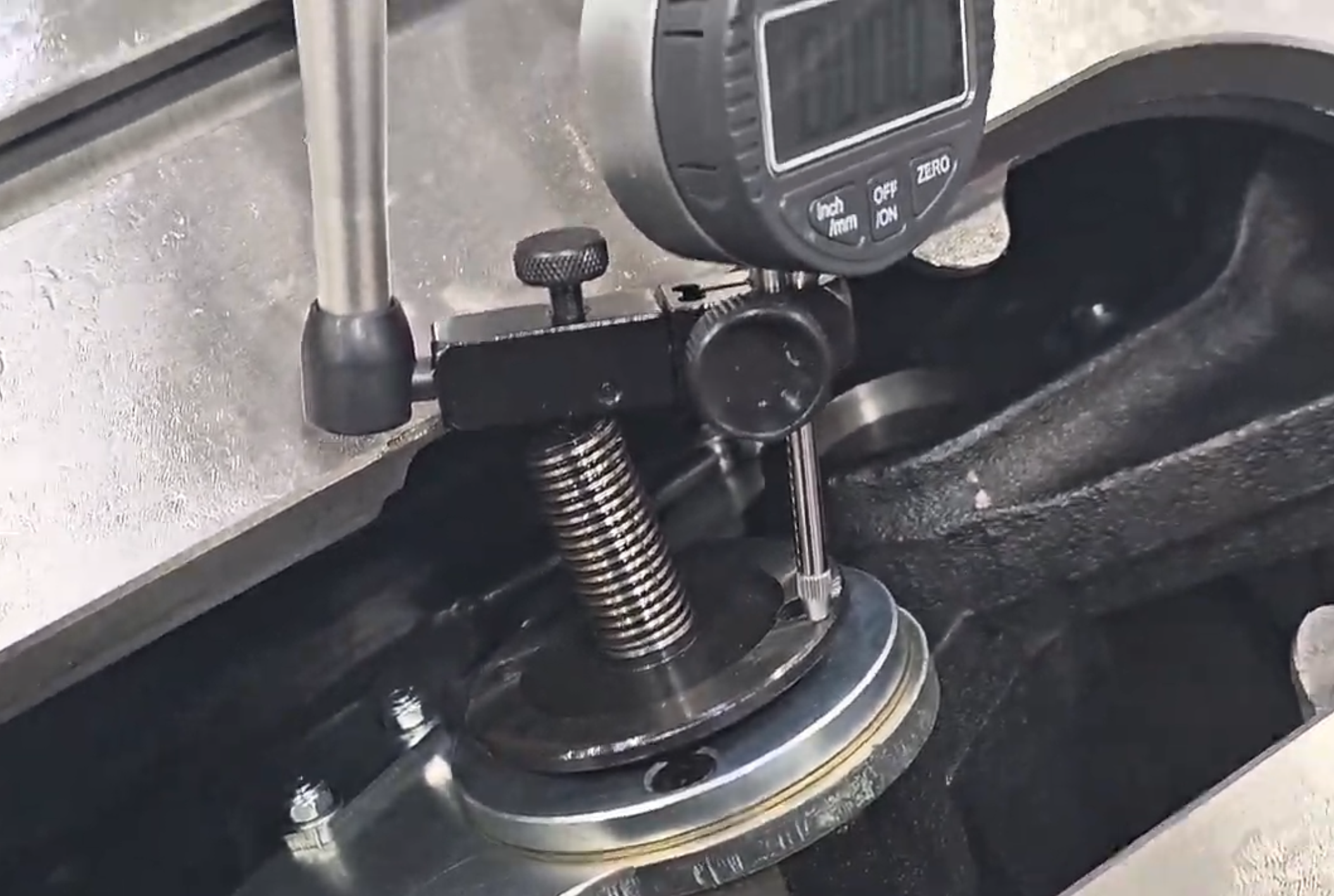 Dial indicator placement on arbor flange avoiding locating pin holes