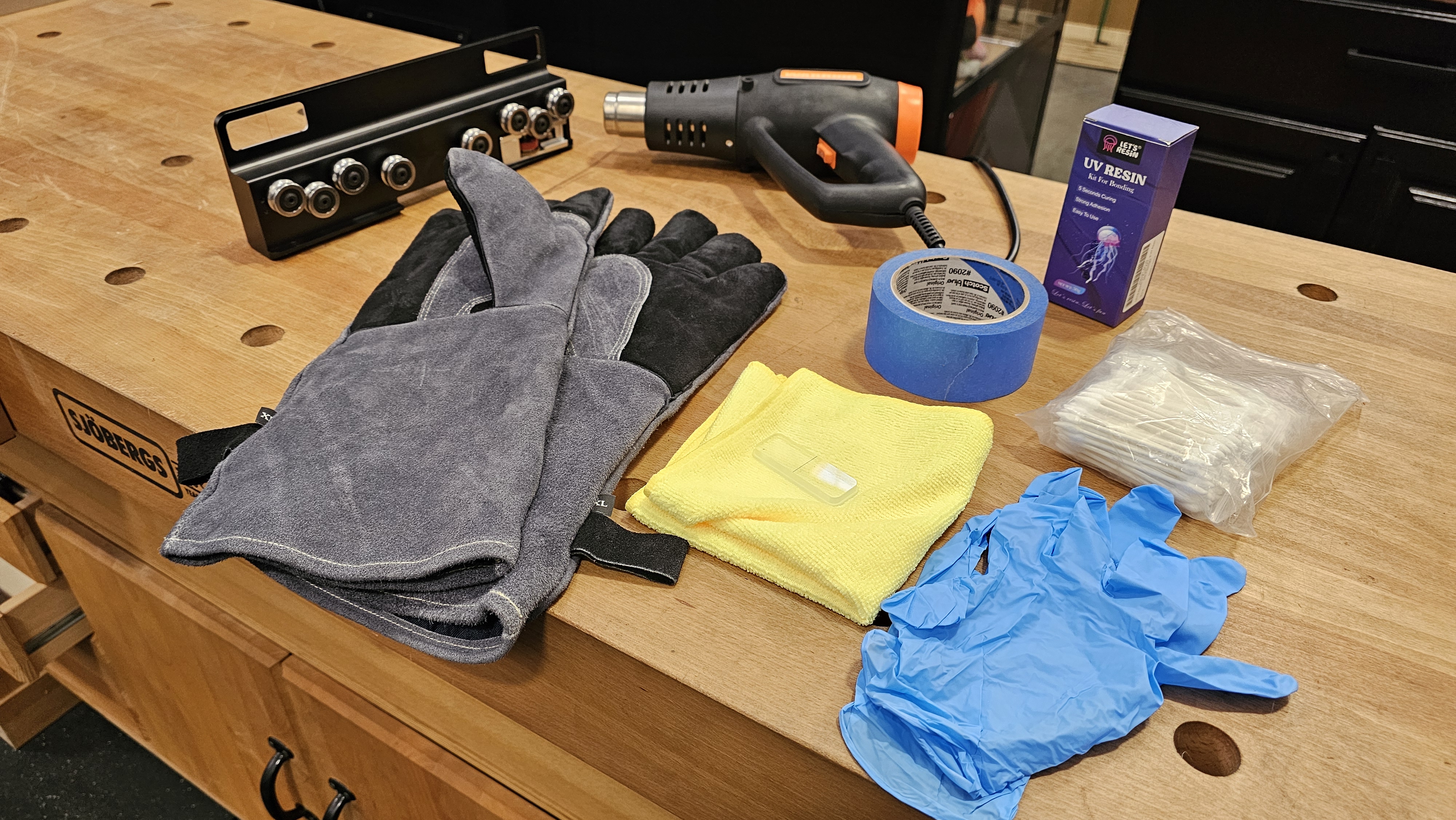 Step 1 — Tools and materials required: heat gun, leather gloves, nitrile gloves, microfiber cloth, replacement viewer, blue tape, UV resin box, Q-tips