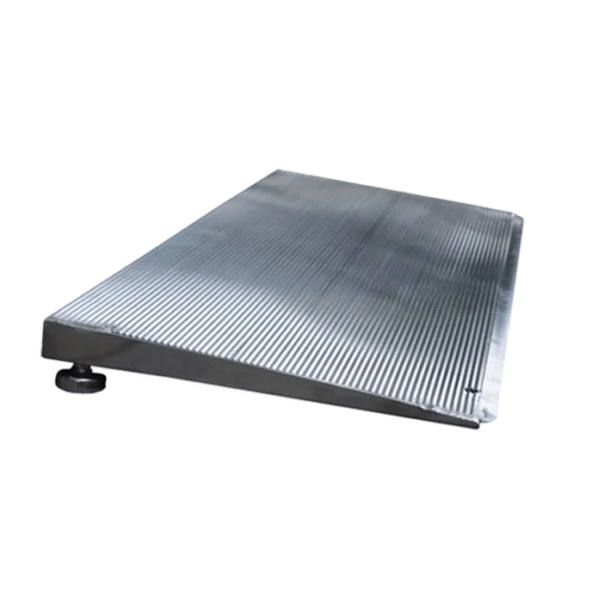 A metal wheelchair ramp with a textured, non-slip surface and an adjustable support foot.