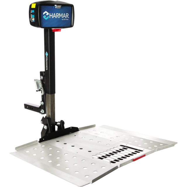 Harmar mobility lift platform with perforated metal surface and control box on a vertical post.