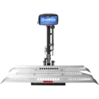 A silver vehicle lift with a black control box labeled "Harmar." It features a metal platform with perforated sections for secure placement.