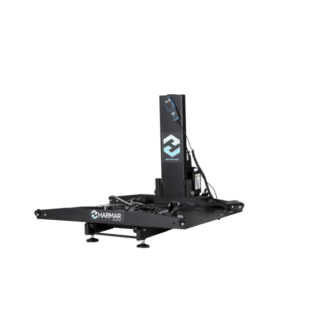 Black Harmar mobility lift featuring a platform and control panel, designed to assist in transporting mobility devices.