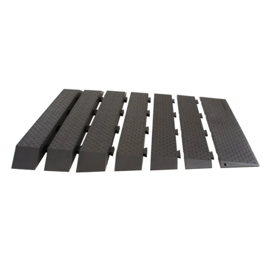 Six black modular cable protector ramps with interlocking edges, featuring a textured surface, designed to safeguard cables and prevent tripping hazards.