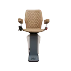 A chairlift with a beige padded seat and armrests, mounted on a vertical rail.