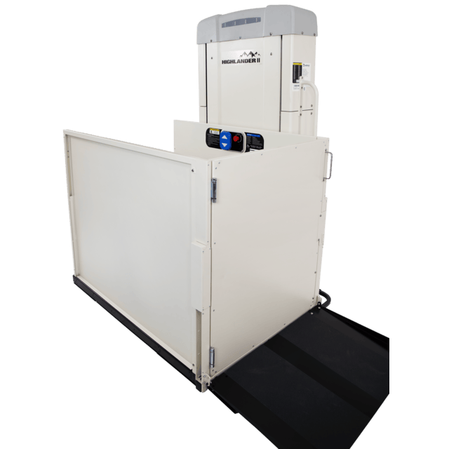 Vertical platform lift with a ramp, safety gate, and control panel, designed for wheelchair accessibility.