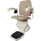 A beige stairlift chair with armrests, footrest, and a seatbelt, designed for navigating stairs easily.