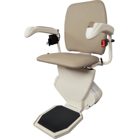 A beige stairlift chair with armrests, footrest, and a seatbelt, designed for navigating stairs easily.