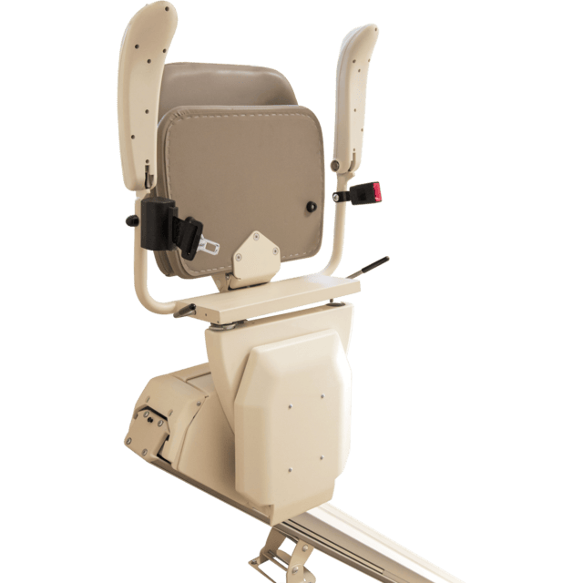 A beige stairlift seat with armrests and safety belt, mounted on a rail system, positioned against a neutral background.