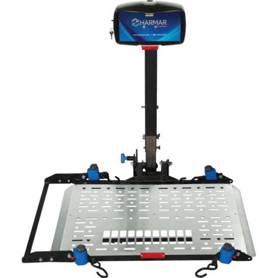 A metal platform lift with a stabilizing pole and a control box at the top, designed for mobility devices.