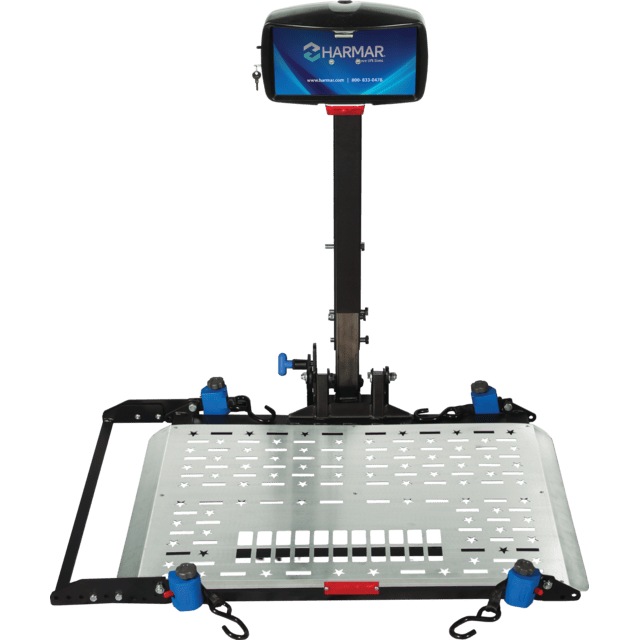 A metal platform lift with a stabilizing pole and a control box at the top, designed for mobility devices.