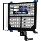 A metal lift platform with star-shaped cutouts and a Harmar logo, designed for mobility device transportation.