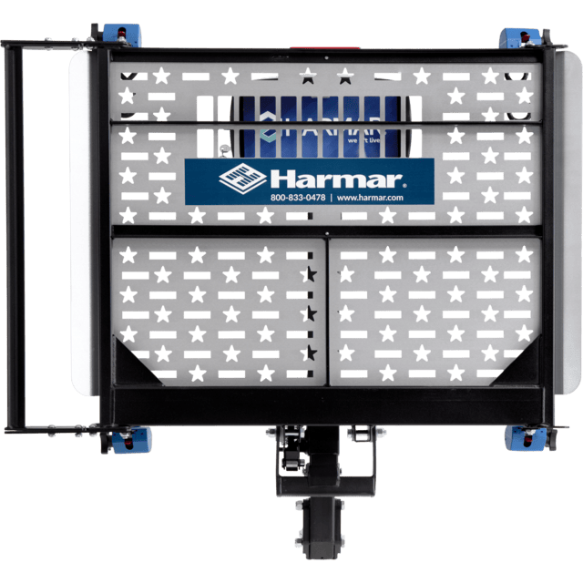 Harmar vehicle lift platform with a perforated metal design and branded sign.