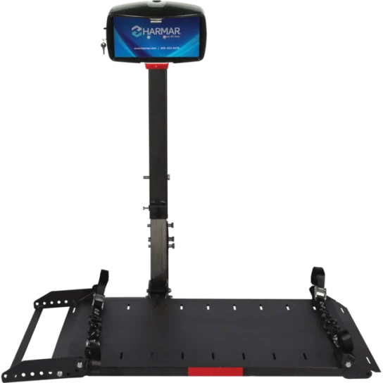 Wheelchair lift platform with a support stand displaying the Harmar logo on a small screen.
