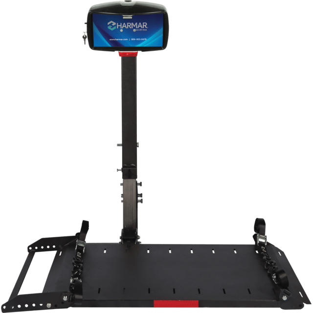 Wheelchair lift platform with a support stand displaying the Harmar logo on a small screen.