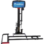 Vertical lift with a blue Harmar sign, featuring a platform and support structure for transporting mobility devices.