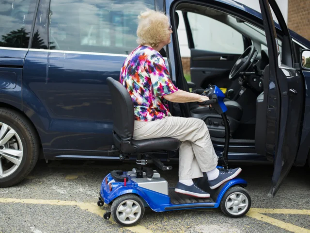 Woman using a blue powerchair
