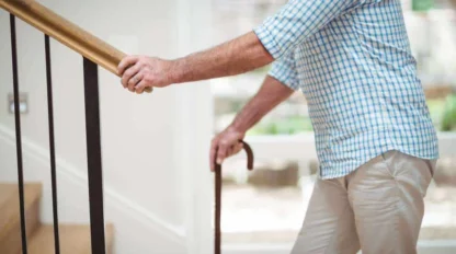 senior man climbing upstairs