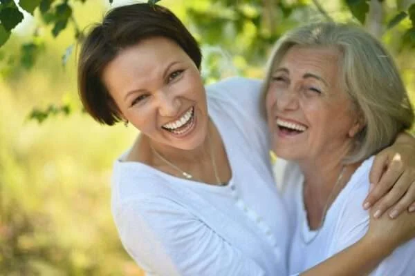 mother and daughter laughing