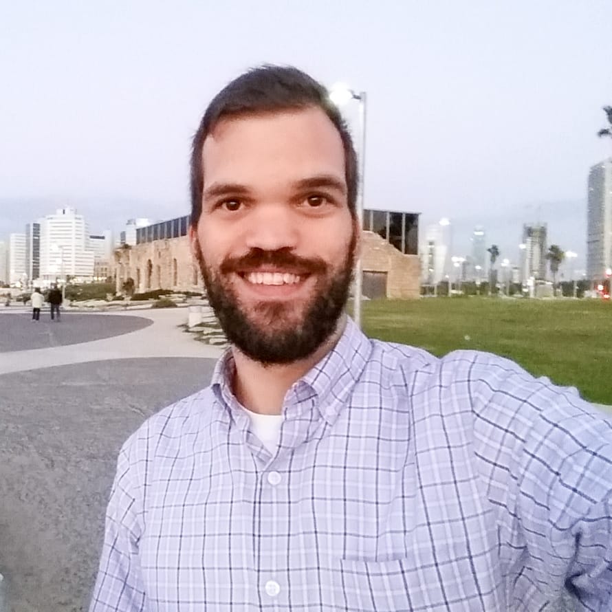 guy smiling while posing for a picture