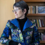 Rabbi Sharon Cohen Anisfeld looking out a window