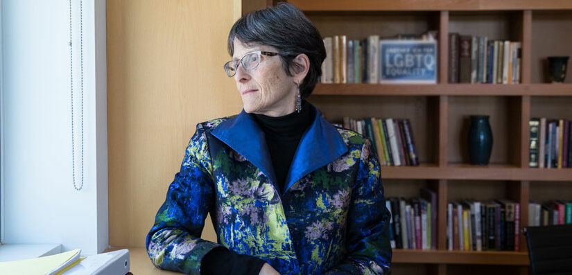 Rabbi Sharon Cohen Anisfeld looking out a window