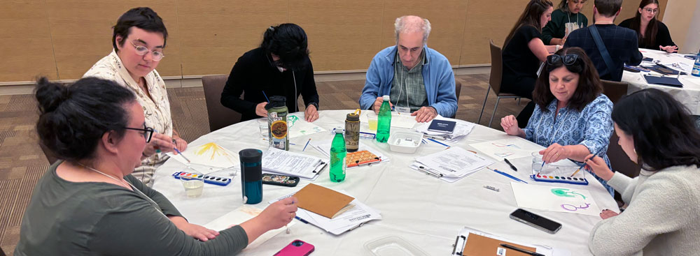 Jennifer Goldberg and other BYB fellows talk around a table