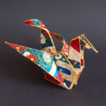 Paper bird sitting on table - 3D pen art.