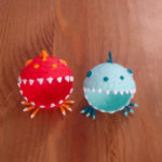 Two small stuffed animals: 3D pen art on table.