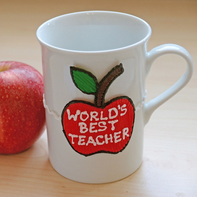 3D pen art decorates white coffee mug with red apple