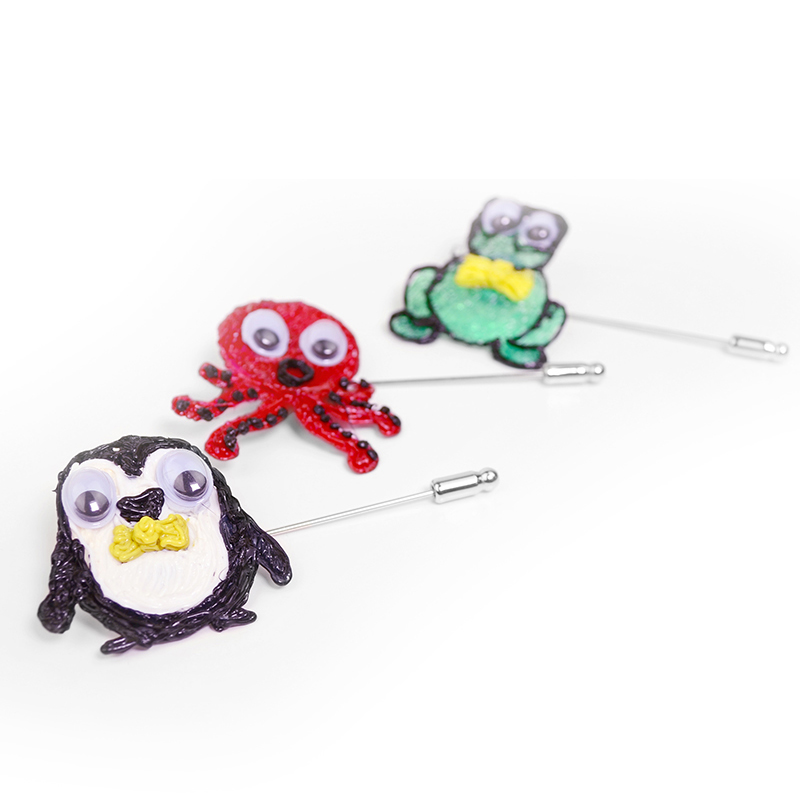 3D penguins in different colors and bow ties on pins.